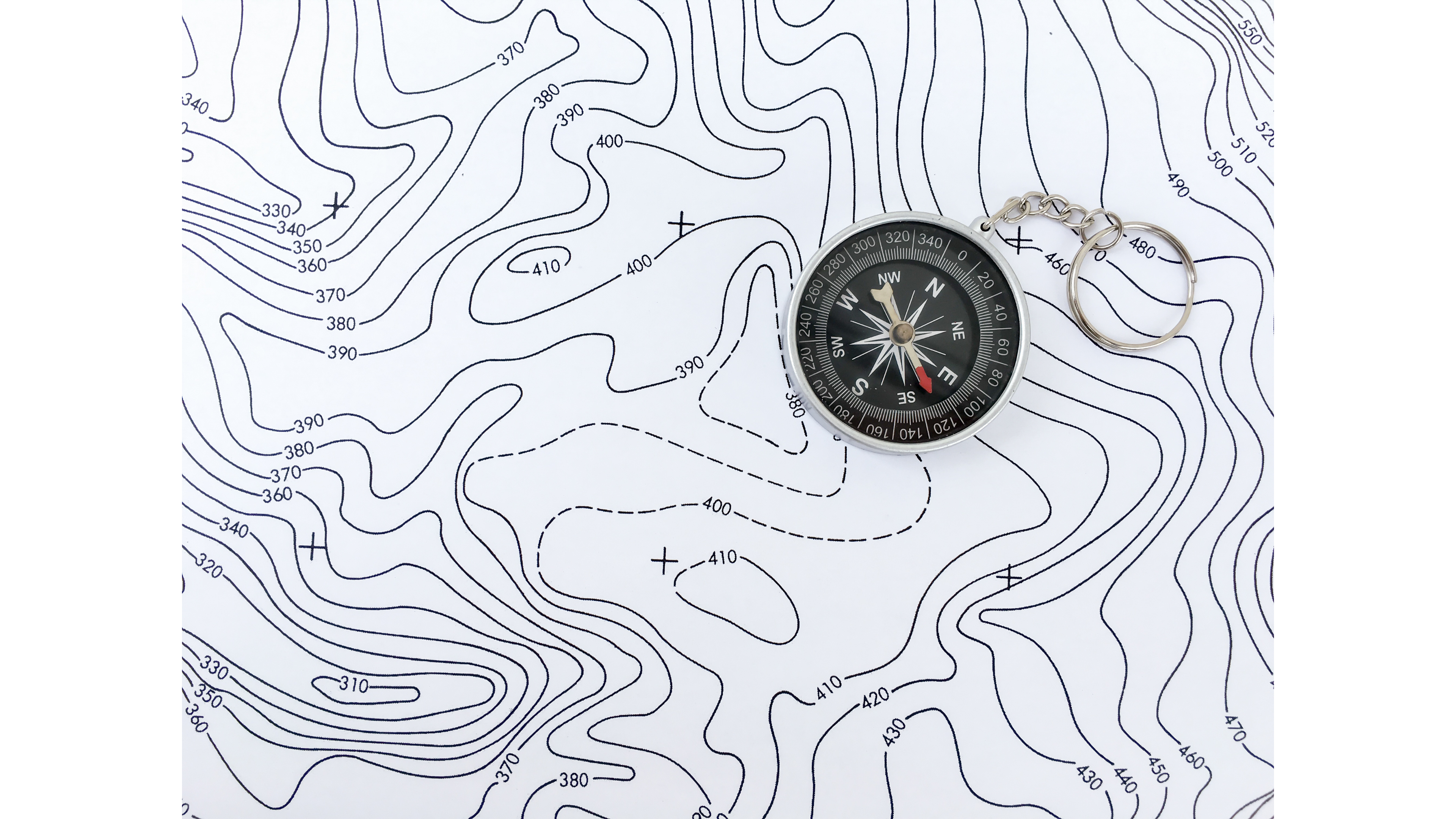 Topographic contour map with a compass
